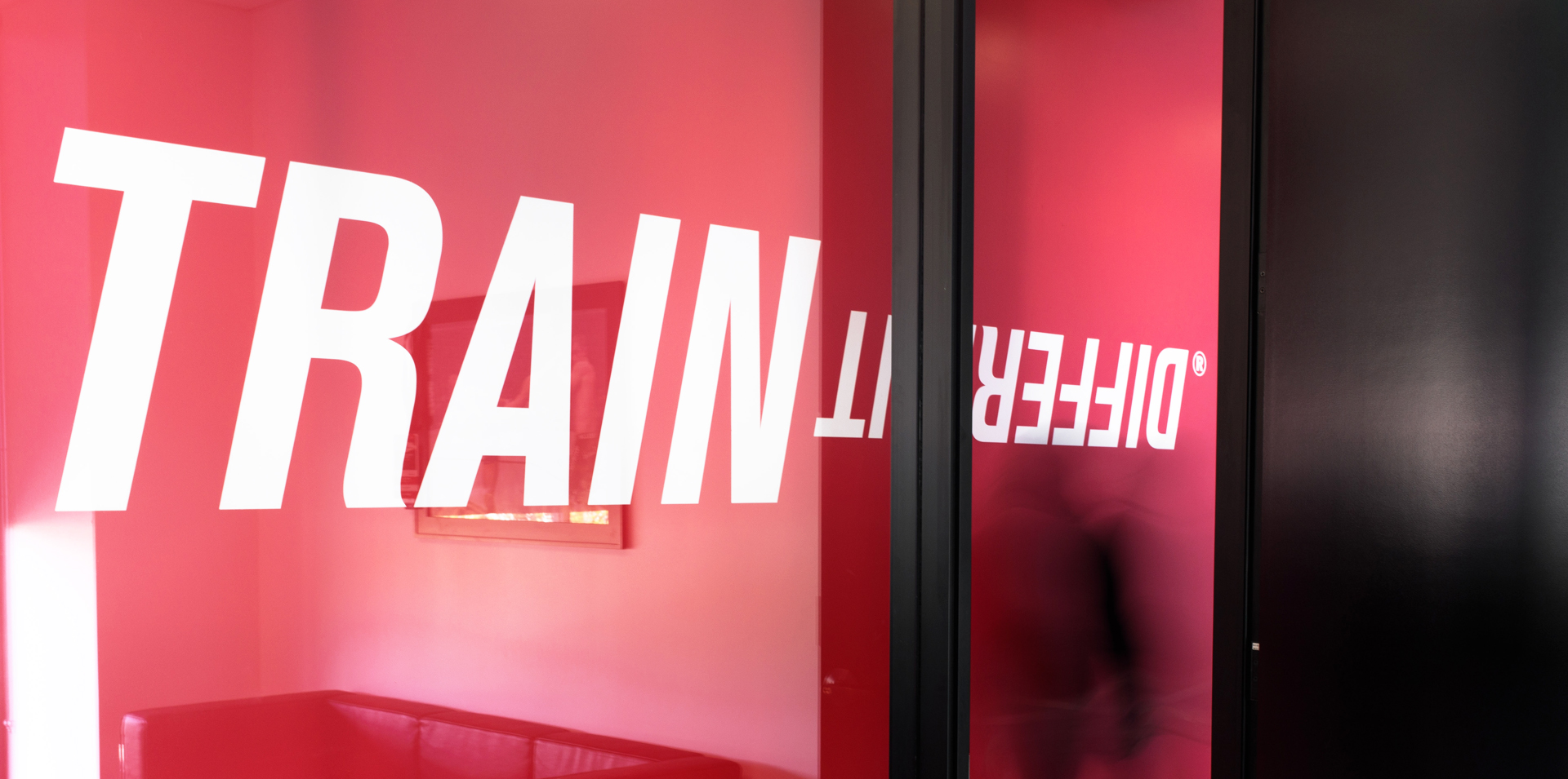 Train Different on red wall image